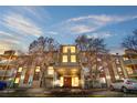 Exterior shot of building with multiple stories and front entrance, landscaping with trees, and multiple balconies at 1300 S Parker Rd # 9, Denver, CO 80231