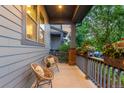 Cozy porch with seating offers a relaxing outdoor space with views of the neighborhood at 5735 Boston St, Denver, CO 80238