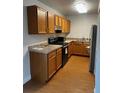 Well-lit kitchen featuring wood cabinets and modern appliances at 6392 S Hill St, Littleton, CO 80120