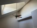 Bright living room featuring high vaulted ceilings, skylight and modern fan at 16366 E Fremont Ave # 11, Aurora, CO 80016
