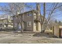 Side angle of a two-story home exterior with a small balcony and bare trees around a parking area at 4529 Barnacle Ct, Boulder, CO 80301