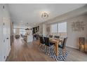 Open dining area with modern lighting and views of the open kitchen concept at 2430 Ames St, Edgewater, CO 80214