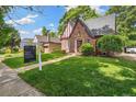 Inviting Tudor-style home with a well-maintained lawn and prominent for-sale signage at 3055 N Albion St, Denver, CO 80207