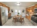 Modern kitchen featuring stainless steel appliances and wood cabinets at 3480 W 96Th Ave, Westminster, CO 80031
