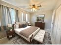 Spacious primary bedroom with ample natural light and a ceiling fan at 3480 W 96Th Ave, Westminster, CO 80031