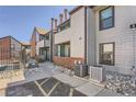 Exterior view showcasing the building's design, siding, and outdoor access at 11937 E Harvard Ave # 102, Aurora, CO 80014