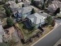 Beautiful home from an aerial view showcasing the backyard, patio, and surrounding neighborhood at 9445 Aspen Hill Cir, Lone Tree, CO 80124