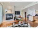 Bright living room with fireplace and hardwood floors at 3601 Arapahoe Ave # 102, Boulder, CO 80303