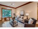 Comfortable living room with large windows, plush seating, and modern décor at 1928 S Washington St, Denver, CO 80210