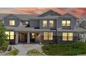 Charming townhome with stone accents, well-kept landscaping, and inviting front porches at 9758 Laredo St # 22D, Commerce City, CO 80022