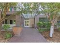 Building entrance featuring a modern awning and brick exterior at 2958 Syracuse St # 403, Denver, CO 80238