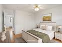 Comfortable bedroom with a queen-size bed, soft lighting, and neutral décor at 1840 E 84Th Ave, Denver, CO 80229