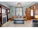 Inviting living room with a decorative fireplace, wooden accents, and a comfortable leather sofa at 1554 N Pennsylvania St, Denver, CO 80203