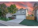 Charming two-story home with a well-manicured lawn and an attached two-car garage at 4249 S Biscay Cir, Aurora, CO 80013