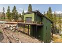 Unique home design with a bridge entrance, garage and mountain views at 581 Fairview Blvd, Breckenridge, CO 80424