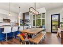 Open-concept living area with a large dining table and views of the mountains at 581 Fairview Blvd, Breckenridge, CO 80424
