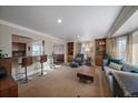 Bright and airy living room featuring built-in bookshelves and a comfortable seating area at 5270 Tabor St, Arvada, CO 80002