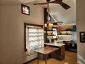 Eat-in kitchen with a wooden table and modern lighting at 3335 Dexter St, Denver, CO 80207