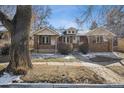 Charming brick home with a well-manicured front yard and inviting curb appeal at 4326 Batavia Pl, Denver, CO 80220