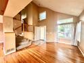 Open living room showcasing hardwood floors, high ceilings, and ample natural light at 10064 Westside Cir, Littleton, CO 80125