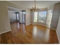 Formal dining room featuring hardwood floors and bay window at 18874 E Ida Ave, Aurora, CO 80015