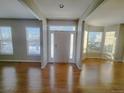 Bright entryway with hardwood floors and neutral color palette at 18874 E Ida Ave, Aurora, CO 80015