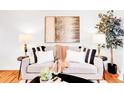 Cozy living room with stylish decor, comfortable sofa, and elegant lighting for a welcoming atmosphere at 4201 Shoshone St, Denver, CO 80211