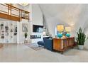 Bright living area with sleek fireplace, modern shelving, and contemporary decor at 6681 S Abilene Way, Centennial, CO 80111