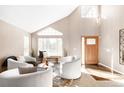 Bright living room with vaulted ceilings and comfortable seating at 9053 W 103Rd Ave, Broomfield, CO 80021