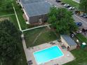 Aerial view of a community pool and green space, perfect for relaxation and outdoor enjoyment at 9650 Huron St # 3, Thornton, CO 80260