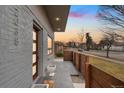 Inviting front door and walkway, with gray brick and modern fence detail at 2038 Meade St, Denver, CO 80211