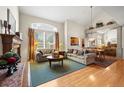 Open concept living and dining area boasts tall ceilings and a large window at 3795 W 104Th Dr # E, Westminster, CO 80031