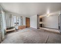 Open-concept living space offering a seamless transition to the kitchen area, with great potential for modern updates at 7917 Chase Cir # 160, Arvada, CO 80003