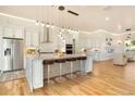 Spacious kitchen featuring modern appliances and large island at 5585 Country Club Dr, Larkspur, CO 80118