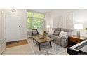 Cozy living room with a large window, comfortable seating, and stylish decor at 2763 Dharma Ave, Broomfield, CO 80020