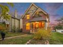 A charming two-story home with well-maintained landscaping and a welcoming front porch at 2841 N Franklin St, Denver, CO 80205