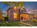 A lovely view of the home showcasing its architectural details and inviting front porch at 2841 N Franklin St, Denver, CO 80205