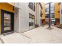 Private patio area with a view of neighboring building at 3225 Blake St # 6, Denver, CO 80205