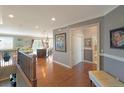 Elegant foyer with hardwood floors, neutral walls, and an open view to living areas at 6638 S Tibet Ct, Aurora, CO 80016