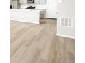 Open floor plan of a living room with access to the kitchen at 765 N Tibet St, Aurora, CO 80018