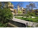 Multi-unit property featuring a bench with beautiful landscaping, lush greenery, and tranquil setting for outdoor enjoyment at 2711 Mapleton Ave # 27, Boulder, CO 80304