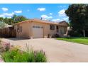 Lovely single story home featuring a spacious driveway, brick exterior, attached garage, and inviting curb appeal at 1803 Graves Ct, Northglenn, CO 80233