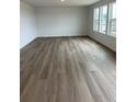 Spacious living room bathed in natural light with neutral walls, offering a versatile area for relaxation and gatherings at 3909 N Shawnee St, Aurora, CO 80019