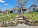 Welcoming front exterior with stone steps leading to a cozy home entrance at 2201 Illinois St, Golden, CO 80401