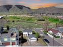 Picturesque street view showing homes near a green space and mountain range at 2201 Illinois St, Golden, CO 80401
