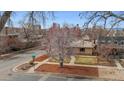 Scenic aerial view showcasing the neighborhood, mature trees, and proximity to the city skyline at 2301 Vine St, Denver, CO 80205