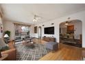 Bright living room with hardwood floors, ample seating, and natural light at 2301 Vine St, Denver, CO 80205