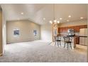 Open kitchen with granite countertops and stainless steel appliances at 12444 Madison Way, Thornton, CO 80241