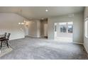 Spacious living room with vaulted ceilings and grey carpet at 12444 Madison Way, Thornton, CO 80241