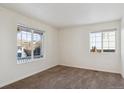 Spacious bedroom with neutral walls and carpeting at 5928 E Conservation Dr, Frederick, CO 80504